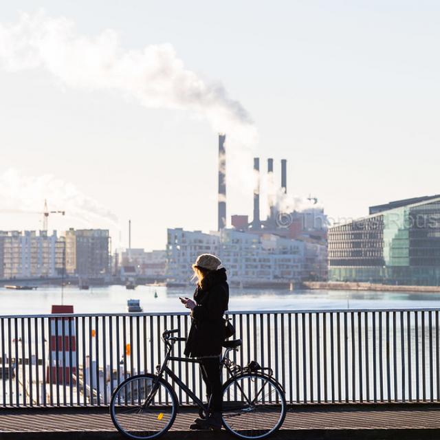 On her bike across the harbour